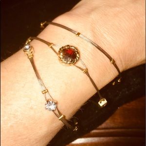 3 slender bracelets variously studded nicely